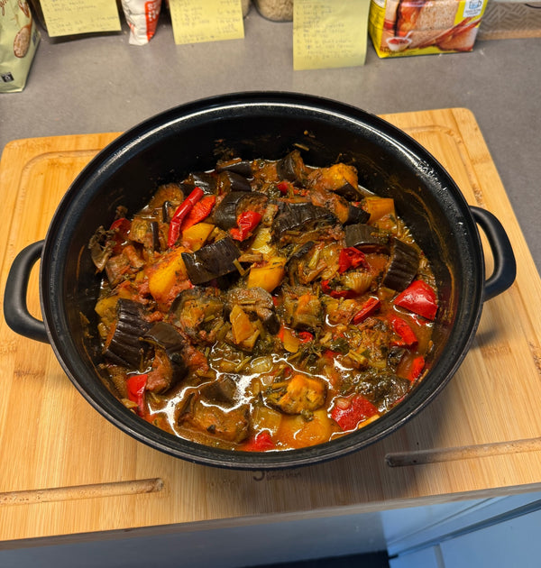 Briam, oven-baked vegetables in a cast iron pot