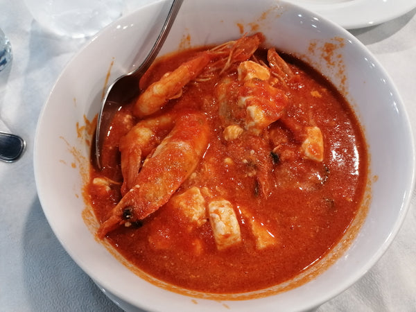 Shrimp saganaki in tomato sauce with feta