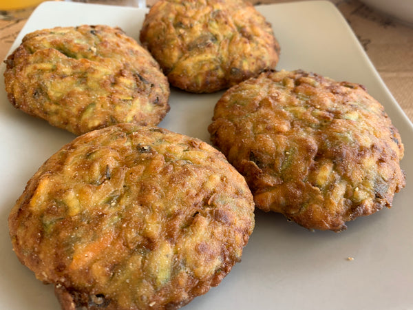 Fried courgette fritters (kolokithokeftedes) on a plate