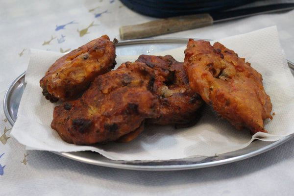 Fried tomato fritters (domatokeftedes) on a metal plate
