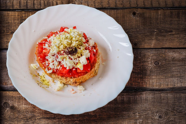Greek dakos with feta, tomato and olive